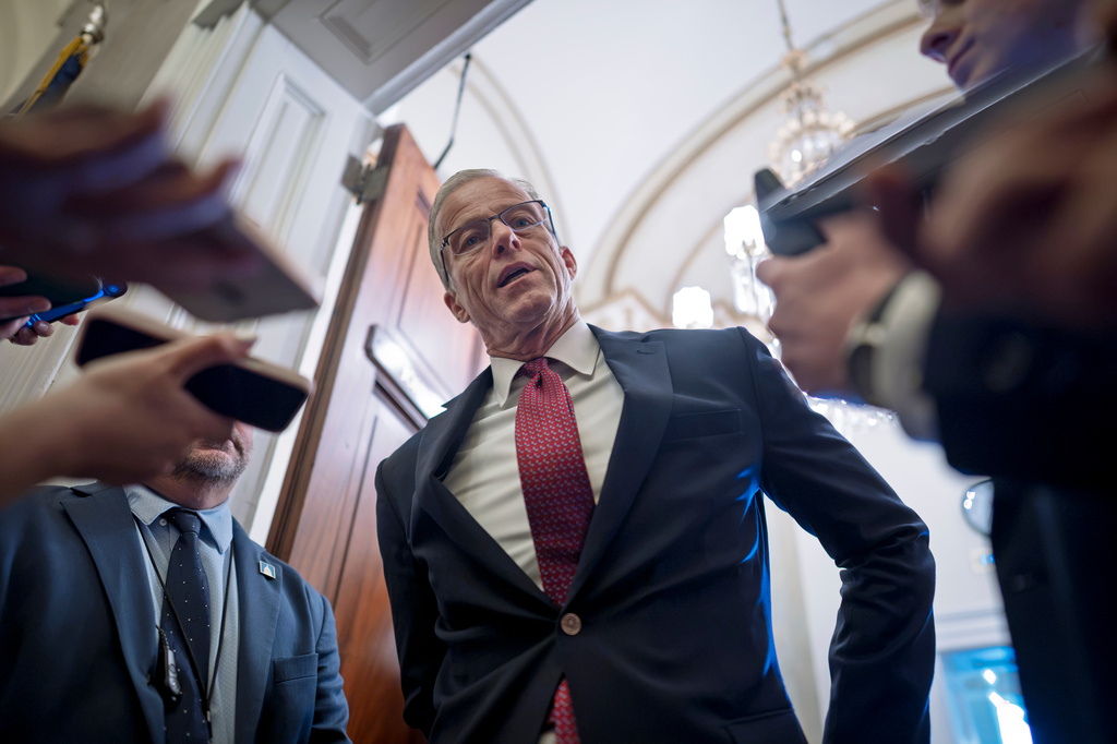 Majority Leader John Thune, R-S.D., responds to reporters asking questions as he enters his office at the Capitol in Washington, Monday, Sept. 28, 2026. (AP Photo/J. Scott Applewhite)