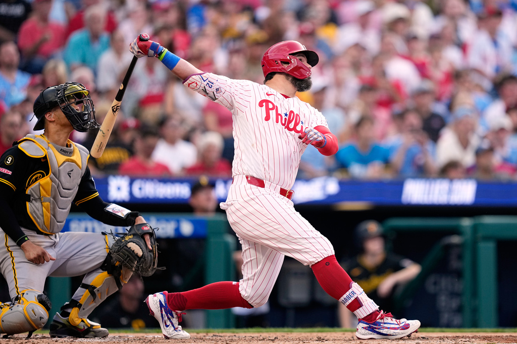 Philadelphia Phillies' Kyle Schwarber follows through after hitting a an RBI-sacrifice fly against Pittsburgh Pirates pitcher Braxton Ashcraft during the third inning of a baseball game Monday, June 29, 2026, in Philadelphia. (AP Photo/Matt Slocum)