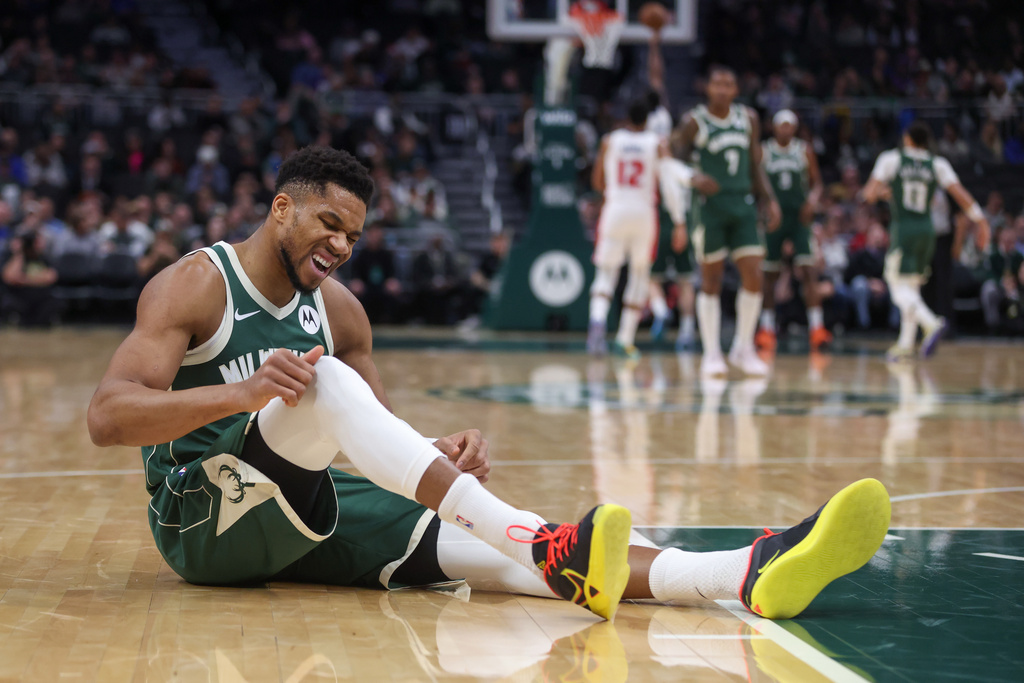Milwaukee Bucks' Giannis Antetokounmpo reacts after suffering an injury during the first half an NBA basketball game against the Detroit Pistons, Wednesday, Dec. 3, 2025, in Milwaukee. (AP Photo/Kylie Bridenhagen)