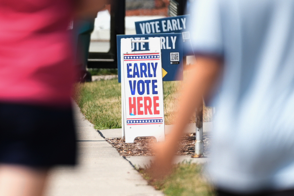 Signs are displayed outside a polling place, Tuesday, July 28, 2026, in Milwaukee. (AP Photo/Nam Y. Huh)