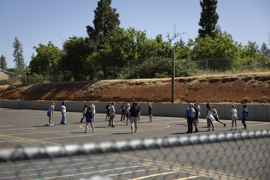 Students play on the playground at Achieve Academy School of Paradise in Paradise, Calif., May 21, 2025. (Miguel Gutierrez Jr./CalMatters via AP)