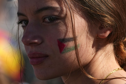 A pro-Palestinian demonstrator gathers for a national general strike called by different unions to protest against the situation in Gaza two days after Israeli forces intercepted a Gaza-bound aid flotilla in the Mediterranean Sea, in Rome, Friday, Oct. 3, 2025. (AP Photo/Alessandra Tarantino) A pro-Palestinian demonstrator gathers for a national general strike called by different unions to protest against the situation in Gaza two days after Israeli forces intercepted a Gaza-bound aid flotilla in the Mediterranean Sea, in Rome, Friday, Oct. 3, 2025. (AP Photo/Alessandra Tarantino)