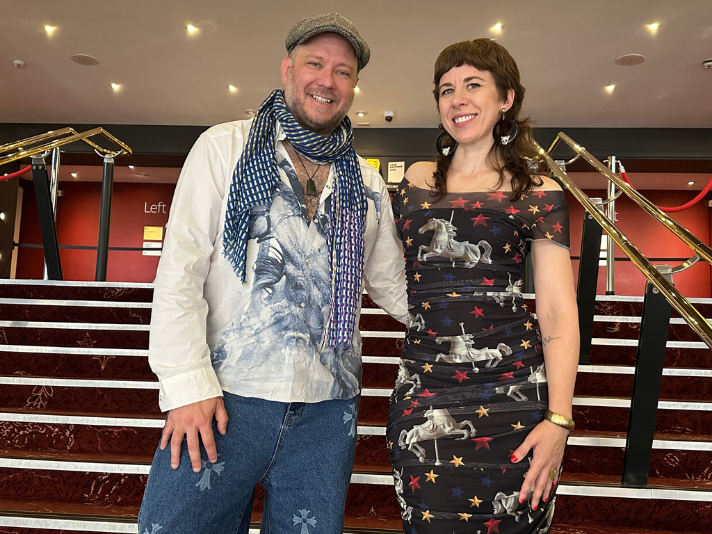 Librettist Royce Vavrek, left, and composer Missy Mazzoli pose at the Festival Theatre in Edinburgh, Scotland, Sunday, Aug. 9, 2026, before the world premiere of their opera “The Galloping Cure” at the Edinburgh International Festival. (AP Photo/Ron Blum)