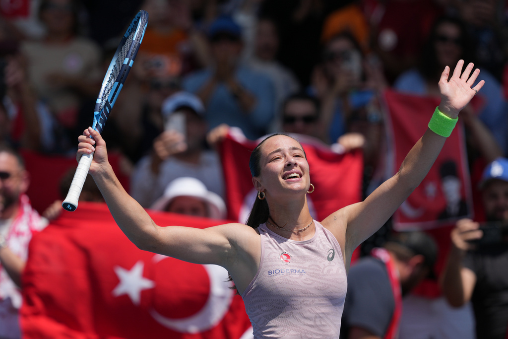 Zeynep Sonmez of Turkey reacts after defeating Anna Bondar of Hungary in their second round match at the Australian Open tennis championship in Melbourne, Australia, Wednesday, Jan. 21, 2026. (AP Photo/Dar Yasin)