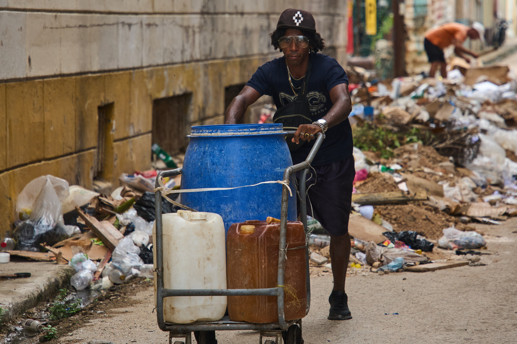 A man pushes a cart of empty containers to fill with water in Havana, Cuba, Friday, June 12, 2026. (AP Photo/Ramon Espinosa)