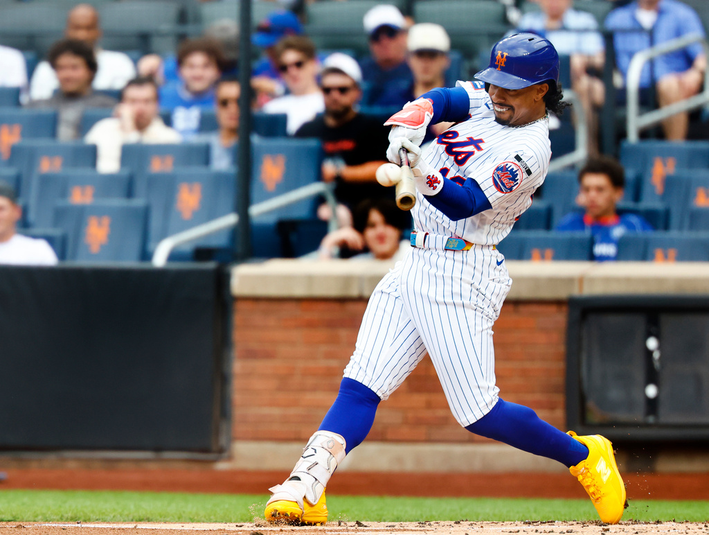 New York Mets' Francisco Lindor hits a home run against the Houston Astros during the first inning of a baseball game, Sunday, Aug. 30, 2026, in New York. (AP Photo/Noah K. Murray)
