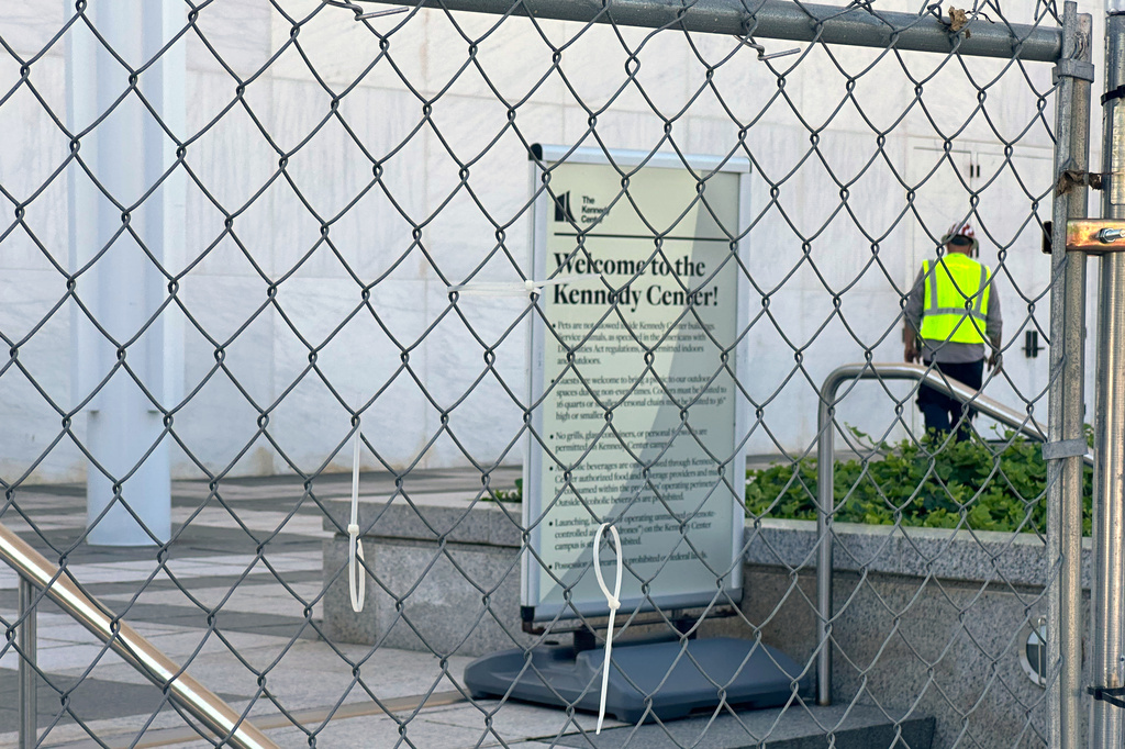 Fencing is placed outside the John F. Kennedy Center for the Performing Arts on Wednesday, Sept. 16, 2026, in Washington. (AP Photo/Nathan Ellgren)