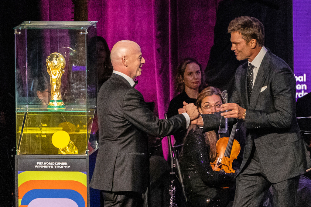 Tom Brady presents an award to the President of the Federation Internationale de Football Association (FIFA) Gianni Infantino at the Global Citizen Awards ceremony, Wednesday, Sept. 24, 2025, in New York. (AP Photo/Stefan Jeremiah)