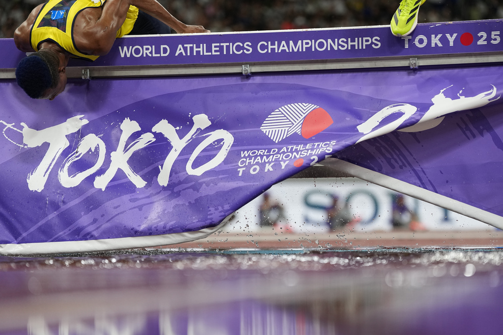 Colombia's Carlos San Martin runs into the barrier during a men's 3,000 meters steeplechase heat at the World Athletics Championships in Tokyo, Saturday, Sept. 13, 2025. (AP Photo/Ashley Landis)