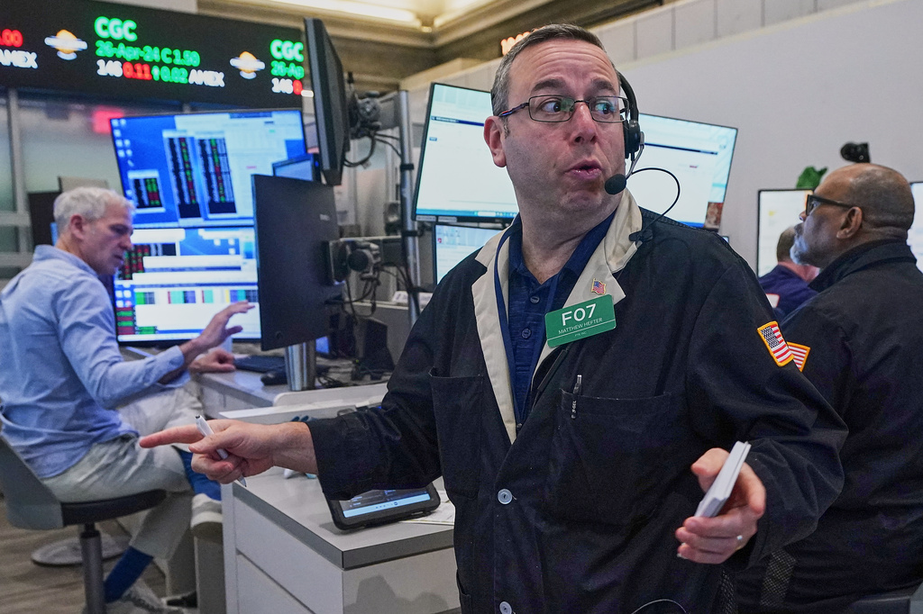 Options trader Matthew Hefter, center, works on the floor of the New York Stock Exchange, Thursday, April 23, 2026. (AP Photo/Richard Drew)
