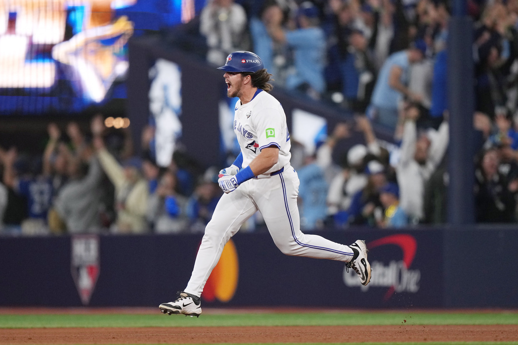 Toronto Blue Jays' Addison Barger rounds the bases after hitting a grand slam against the Los Angeles Dodgers during the sixth inning in Game 1 of baseball's World Series, Friday, Oct. 24, 2025, in Toronto. (Nathan Denette/The Canadian Press via AP)