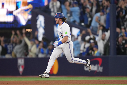 Toronto Blue Jays' Addison Barger rounds the bases after hitting a grand slam against the Los Angeles Dodgers during the sixth inning in Game 1 of baseball's World Series, Friday, Oct. 24, 2025, in Toronto. (Nathan Denette/The Canadian Press via AP) Toronto Blue Jays' Addison Barger rounds the bases after hitting a grand slam against the Los Angeles Dodgers during the sixth inning in Game 1 of baseball's World Series, Friday, Oct. 24, 2025, in Toronto. (Nathan Denette/The Canadian Press via AP)