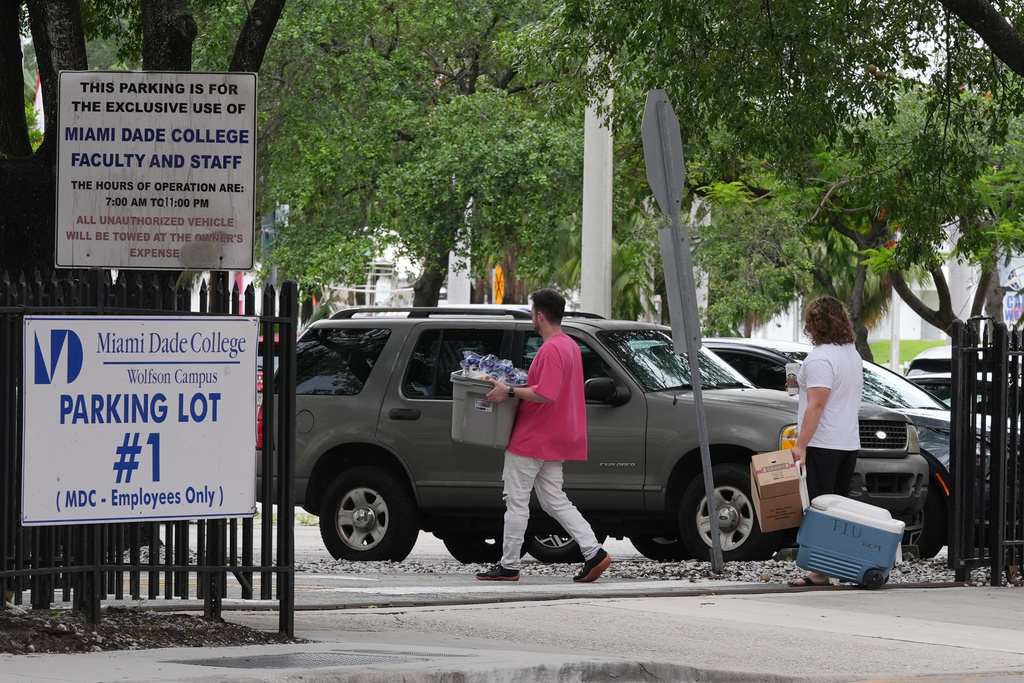 Republican Florida Gov. Ron DeSantis is proposing that President Donald Trump's presidential library be built in a parking lot that is currently used by Miami-Dade College staff and faculty and is adjacent to the Freedom Tower, Tuesday, Sept. 23, 2025, in Miami. (AP Photo/Marta Lavandier)
