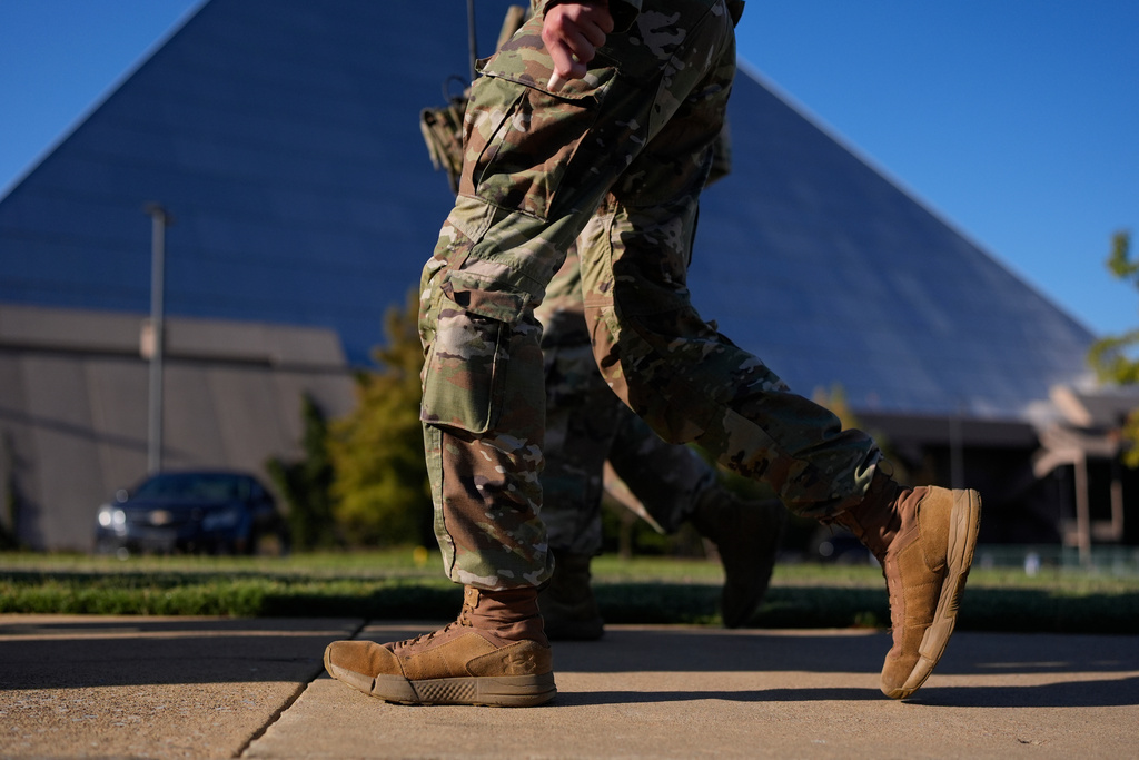 A member of National Guard patrol outside a Bass Pro Shops, Friday, Oct. 10, 2025, in Memphis, Tenn. (AP Photo/George Walker IV)