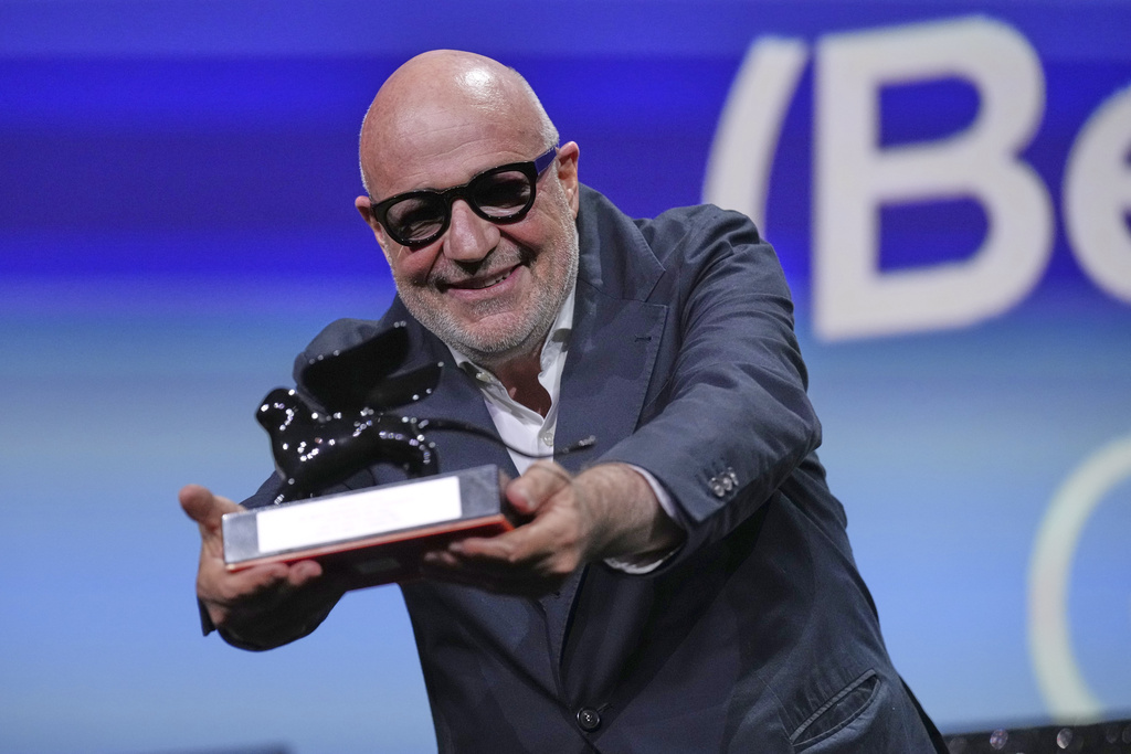 Director Gianfranco Rossi accepts the special jury prize for 'Below the Clouds' during the awards ceremony of the 82nd edition of the Venice Film Festival in Venice, Italy, on Saturday, Sept. 6, 2025. (Photo by Alessandra Tarantino/Invision/AP)
