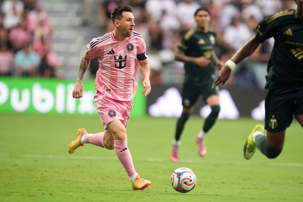 Inter Miami midfielder Leo Messi carries the ball downfield during the first half of an MLS soccer match against the Portland Timbers, Sunday, May 17, 2026, in Miami. (AP Photo/Rebecca Blackwell)