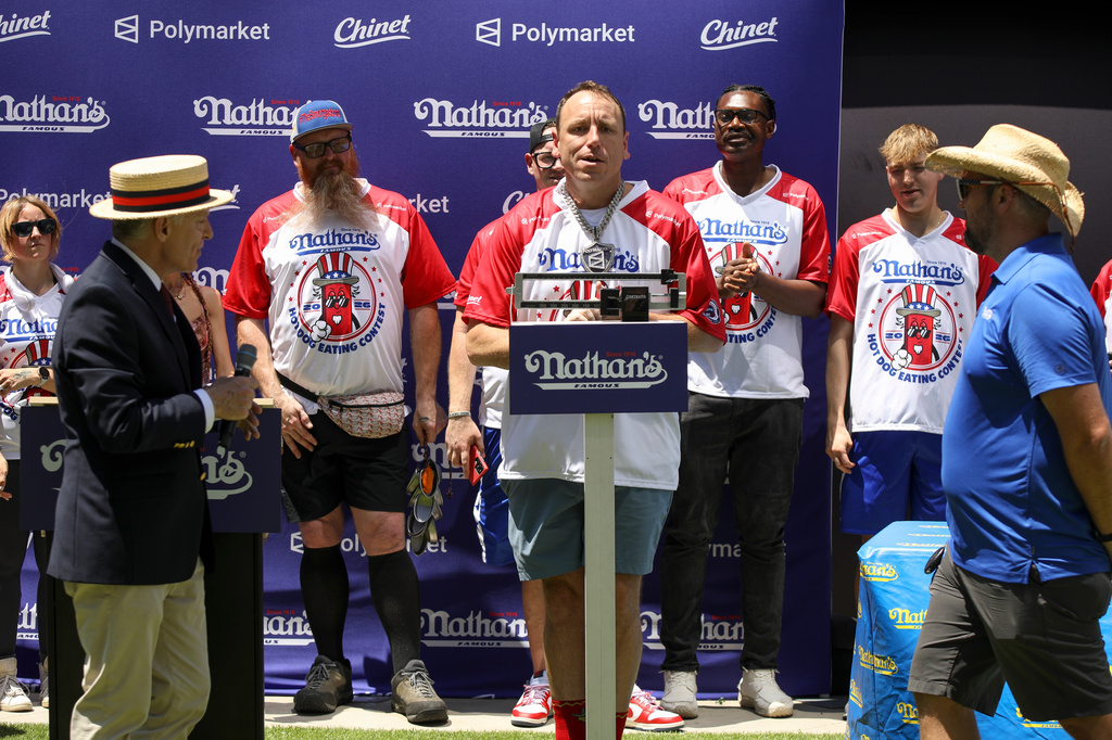 Joey Chestnut stands on a scale at the Nathan's Famous Fourth of July International Hot Dog Eating Contest weigh-in ceremony at Hudson Yards on Friday, July 3, 2026, in New York. (Photo by Andy Kropa/Invision/AP)