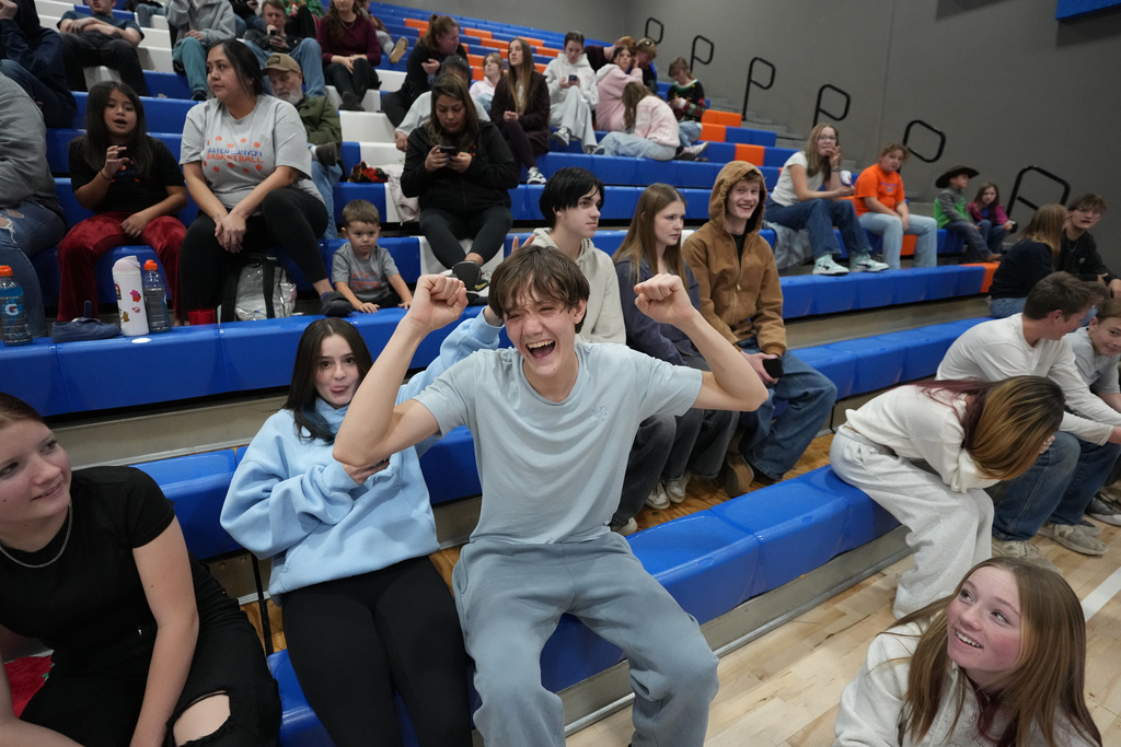 Students cheer during a basketball game at Water Canyon High School Friday, Dec. 5, 2025, in Hildale, Utah. (AP Photo/Rick Bowmer)