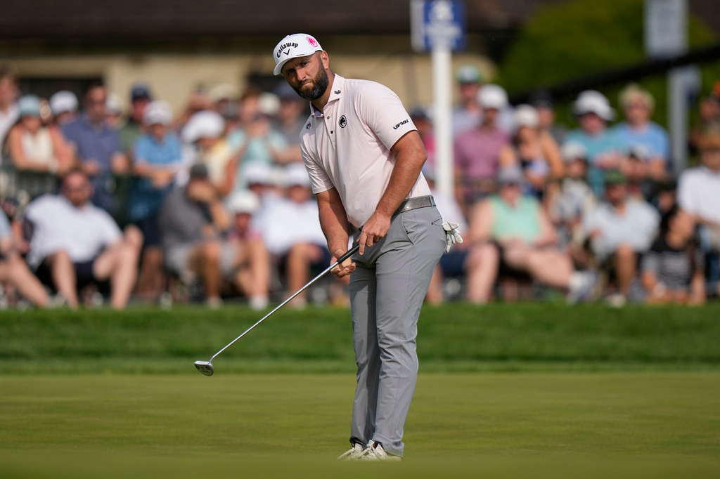 Jon Rahm, of Spain, putts on the 18th green during the third round of the PGA Championship golf tournament at Aronimink Golf Club, Saturday, May 16, 2026, in Newtown Square, PA. (AP Photo/Frank Franklin II)