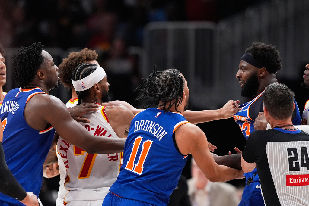 New York Knicks center Mitchell Robinson (23) and Atlanta Hawks guard Dyson Daniels (5) fight in the first half during Game 6 in a first-round NBA basketball playoffs series Thursday, April 30, 2026, in Atlanta. (AP Photo/Brynn Anderson)
