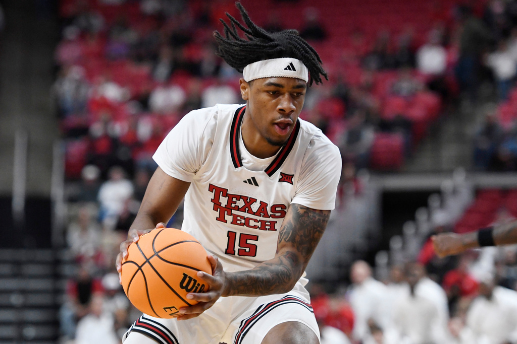 Texas Tech forward JT Toppin (15) rebounds the ball during the first half in an NCAA college basketball game against New Orleans, Wednesday, Nov. 26, 2025, in Lubbock, Texas. (AP Photo/Annie Rice)