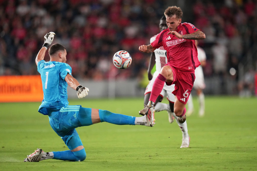 St. Louis City's Conrad Wallem (6) controls the ball as Toronto FC goalkeeper Luka Gavran, left, defends during the second half of an MLS soccer match Saturday, Sept. 19, 2026, in St. Louis. (AP Photo/Jeff Roberson)