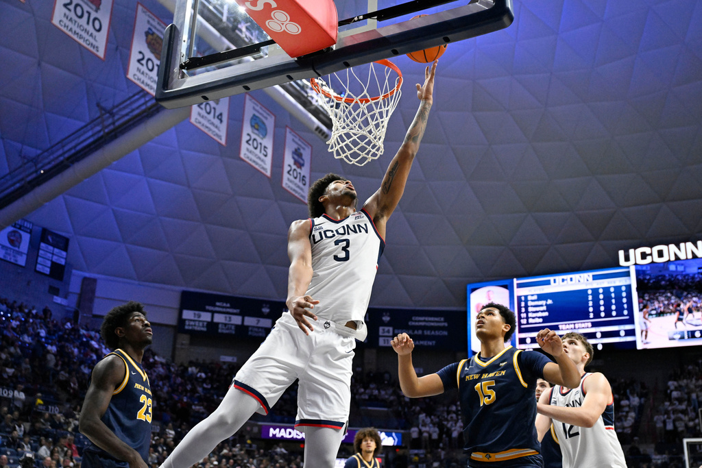 UConn forward Jaylin Stewart (3) makes a basket against New Haven during the first half of an NCAA college basketball game, Monday, Nov. 3, 2025, in Storrs, Conn. (AP Photo/Jessica Hill)