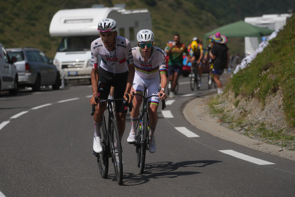 Mexico's Isaac Del Toro and Slovenia's Tadej Pogacar lead the race during the sixth stage of the Tour de France cycling race over 201.5 kilometers (115.5 miles) with start in Pau and finish in Gavarnie-Gedre, France, Thursday, July 9, 2026. (AP Photo/Thibault Camus)
