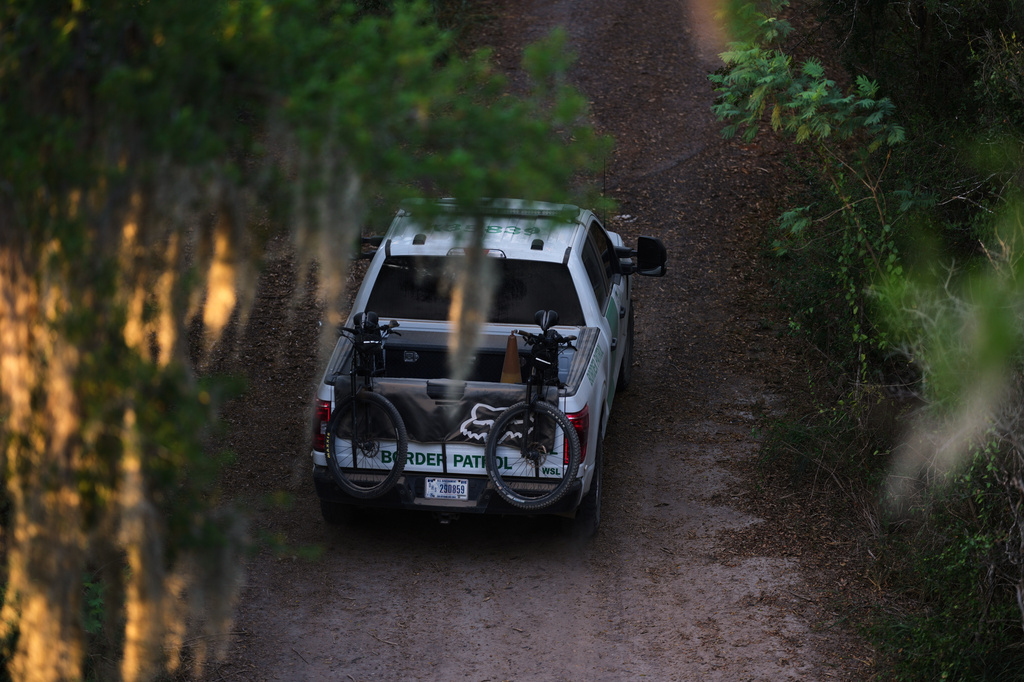 A U.S. Border Patrol vehicle passes through the Santa Ana Wildlife Refuge in Alamo, Texas, Monday, Aug. 24, 2026. (AP Photo/Eric Gay)