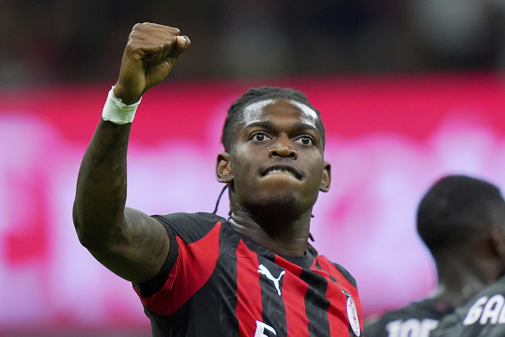 AC Milan's Rafael Leao celebrates after scoring the opening goal during the round of 64 of the Italian Cup soccer match between Milan and Bari, at San Siro Stadium in Milan, Italy, Sunday, Aug. 17, 2025. (Spada/LaPresse via AP)