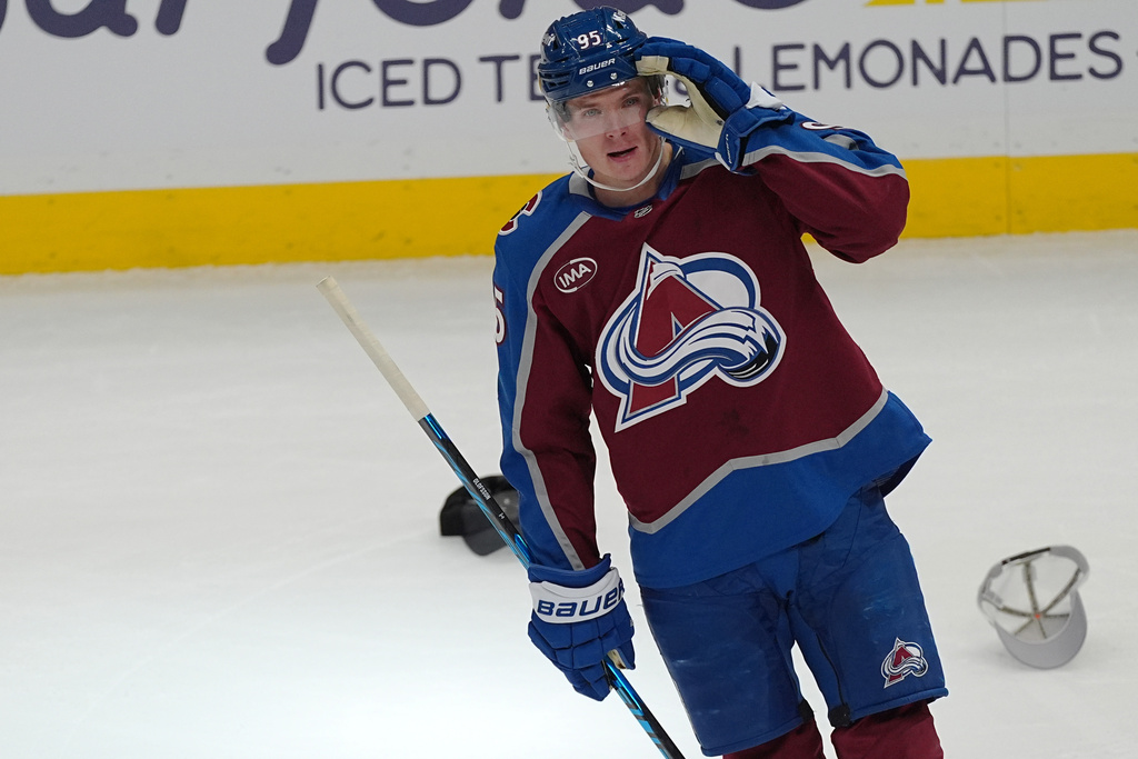 Colorado Avalanche left wing Victor Olofsson gestures to the crowd after scoring his third goal in the third period of an NHL hockey game against the New Jersey Devils Tuesday, Oct. 28, 2025, in Denver. (AP Photo/David Zalubowski)