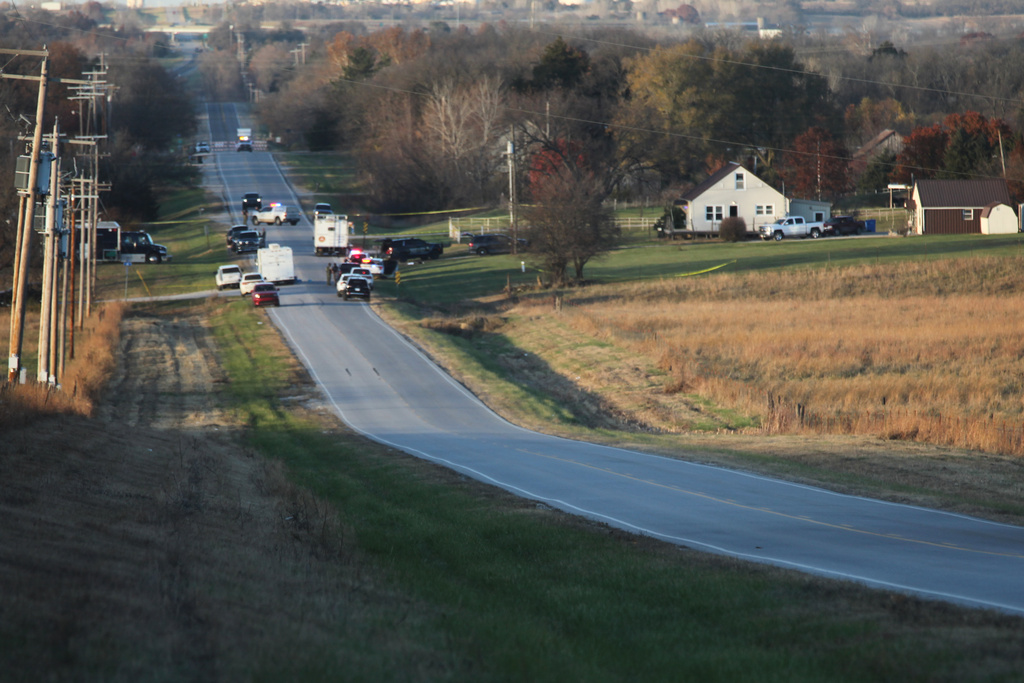 Law enforcement blocks the road to the scene of a shooting, which resulted in multiple casualties, Saturday, Nov. 15, 2025, in Carbondale, Kansas. (AP Photo/John Hanna)