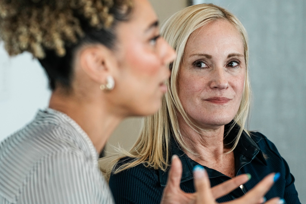 Kristin Lemkau, CEO, J.P. Morgan Wealth Management, listens to Ally Love, Peloton Instructor + VP, Instructor Strategy & Development, during an interview after taking part in a Pro Athlete event at JPMorganChase headquarters in New York, Wednesday, March 18, 2026. (AP Photo/Eduardo Munoz Alvarez)