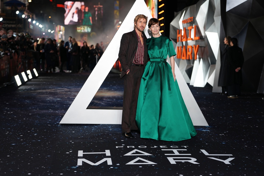 Ryan Gosling, left, and Sandra Huller pose for photographers upon arrival at the World premiere of the film 'Project Hail Mary' on Monday, March 9, 2026, in London. (Photo by Scott A Garfitt/Invision/AP)