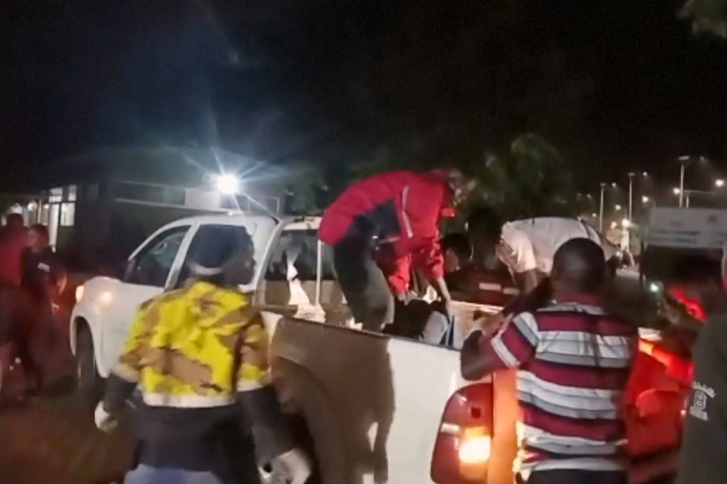 This grab from video provided by Ugandan Red Cross shows injured children being brought in a pickup vehicle to a hospital after an elementary bus crashed Thursday night in the Kapchorwa District in eastern Uganda, Thursday, July 16, 2026. (Ugandan Red Cross via AP)