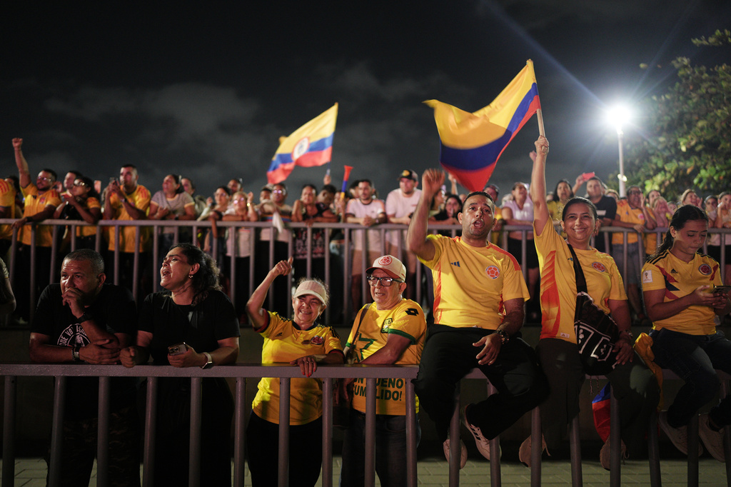 Supporters listen to presidential candidate Abelardo de la Espriella of the Defenders of the Motherland movement speaking aboard a barge on the Magdalena River after leading the first round of the presidential election and advancing to a runoff in Barranquilla, Colombia, Sunday, May 31, 2026. (AP Photo/Ivan Valencia)