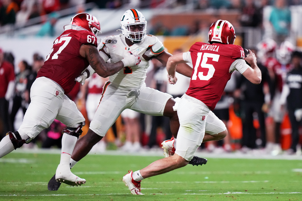 Indiana quarterback Fernando Mendoza looks to pass against Miami during the first half of the College Football Playoff national championship game, Monday, Jan. 19, 2026, in Miami Gardens, Fla. (AP Photo/Lynne Sladky)