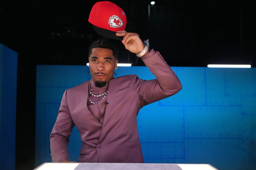 LSU defensive back Mansoor Delane puts on a hat after being chosen by the Kansas City Chiefs with the sixth overall pick during the first round of the NFL football draft, Thursday, April 23, 2026, in Pittsburgh. (AP Photo/Jeff Roberson)