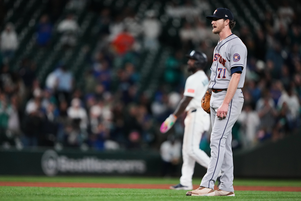 Houston Astros relief pitcher Josh Hader reacts after driving in a run by walking Seattle Mariners' Julio Rodríguez with the bases loaded during the 10th inning of a baseball game, Wednesday, Sept. 23, 2026, in Seattle. (AP Photo/Lindsey Wasson)