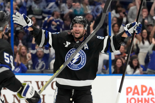 Tampa Bay Lightning right wing Nikita Kucherov (86) celebrates after picking up assist for his 1,000th career point on a goal by center Brayden Point during the second period of an NHL hockey game against the Anaheim Ducks Saturday, Oct. 25, 2025, in Tampa, Fla. (AP Photo/Chris O'Meara) Tampa Bay Lightning right wing Nikita Kucherov (86) celebrates after picking up assist for his 1,000th career point on a goal by center Brayden Point during the second period of an NHL hockey game against the Anaheim Ducks Saturday, Oct. 25, 2025, in Tampa, Fla. (AP Photo/Chris O'Meara)