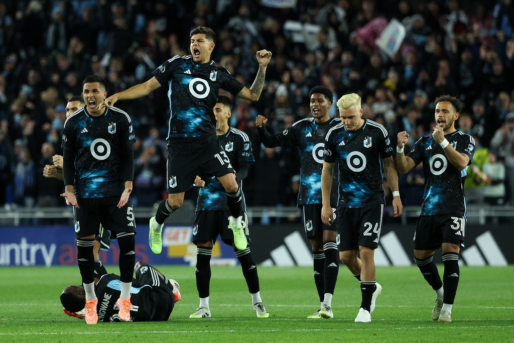 Minnesota United players celebrate during penalty kicks of Game 1 in the first round of MLS soccer's Western Conference playoffs against Seattle Sounders, Monday, Oct. 27, 2025, in St. Paul, Minn. (AP Photo/Matt Krohn)