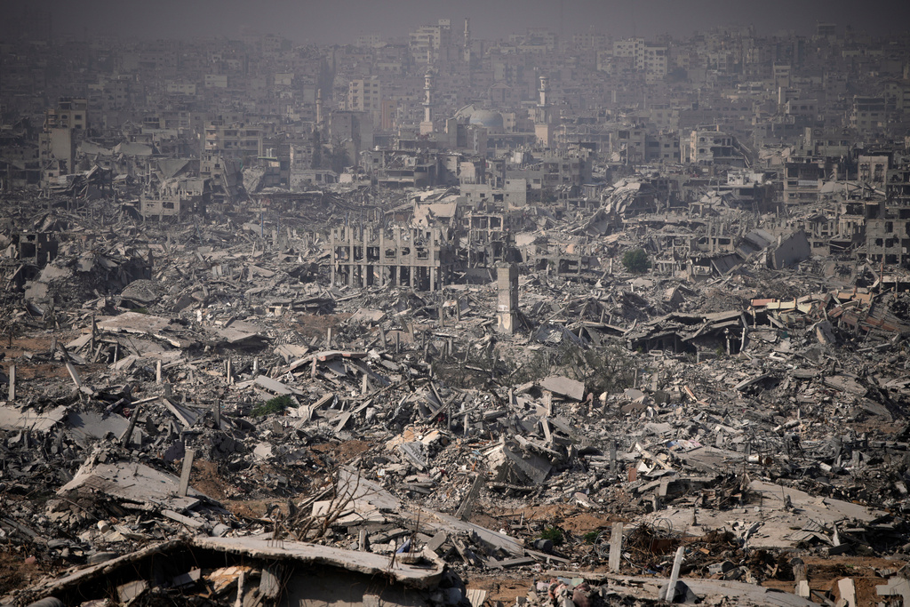Buildings destroyed by the Israeli military are in ruins in the Shijaiya neighborhood of Gaza City, during an army-organized tour for journalists, Wednesday, Nov. 5, 2025. (AP Photo/Ohad Zwigenberg)