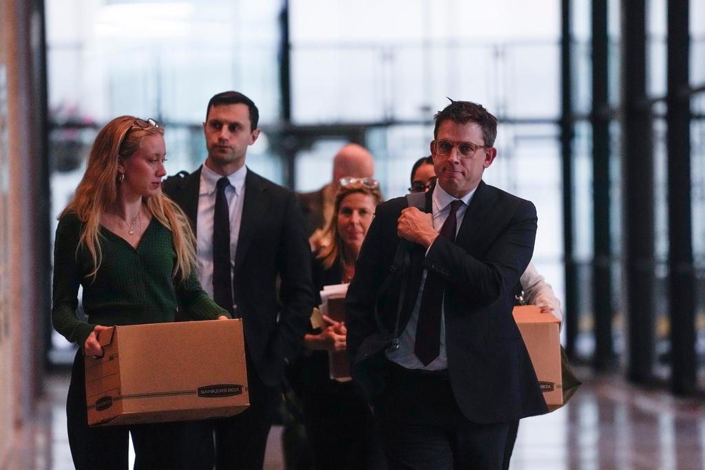 Attorney Steve Art of civil rights law firm Loevy and Loevy, right, part of the legal team for the plaintiffs, leaves the Dirksen Federal Courthouse after a hearing held by U.S. District Judge Sara Ellis to learn more about tactics used in the Trump administration's immigration crackdown, Monday, Oct. 20, 2025, in Chicago. (AP Photo/Erin Hooley)
