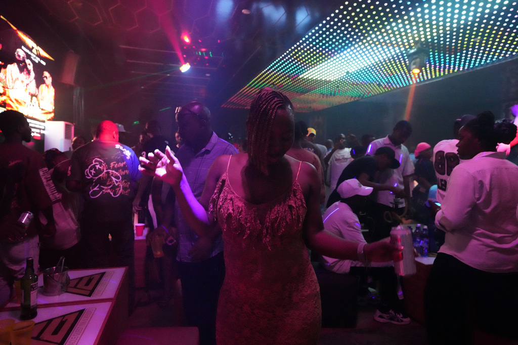 A partygoer dances to Afrobeats inside a nightclub in Sokoto, Nigeria, July 18, 2026. (AP Photo/Sunday Alamba)