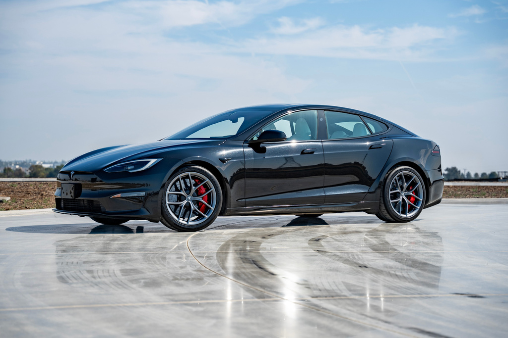 This photo provided by Tesla shows the Model S, one of the first mass-produced EVs. The base model has all-wheel drive and an EPA-estimated range of 410 miles. (Courtesy of Edmunds via AP)