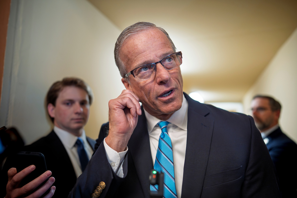 Senate Majority Leader John Thune, R-S.D., talks with reporters about a funding bill to end the shutdown of the Department of Homeland Security shutdown that began more than a month ago, at the Capitol in Washington, Monday, March 23, 2026. (AP Photo/J. Scott Applewhite)