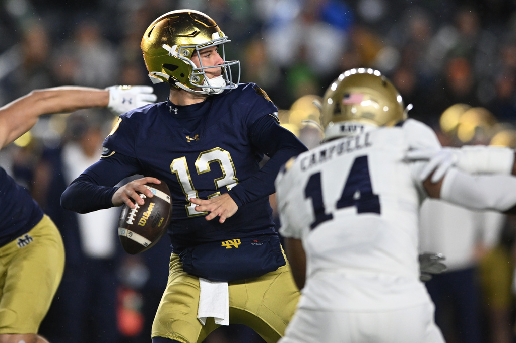 FILE - Notre Dame quarterback CJ Carr prepares to throw a pass during the first quarter of an NCAA football game against Navy, Nov. 8, 2025, in South Bend, Ind. (AP Photo/Paul Beaty, File)