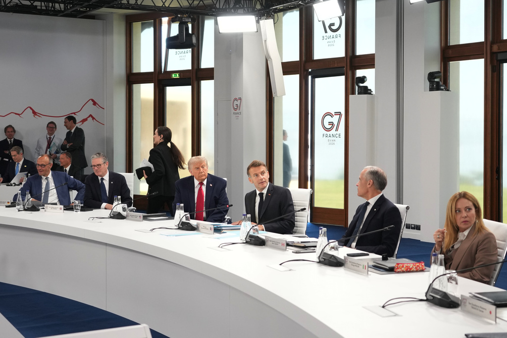 From right, Italian Prime Minister Giorgia Meloni, Canadian Prime Minister Mark Carney, French President Emmanuel Macron, U.S. President Donald Trump, British Prime Minister Keir Starmer, German Chancellor Friedrich Merz during a working session at the G7 summit in Evian-les-Bains, France, Wednesday, June 17, 2026. (AP Photo/Thibault Camus)
