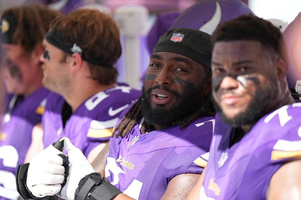 FILE - Minnesota Vikings guard Donovan Jackson (74) checks a replay on the video board during an NFL football game against the Tampa Bay Buccaneers in Tampa, Fla., Sept. 27, 2026. (AP Photo/Peter Joneleit, File)