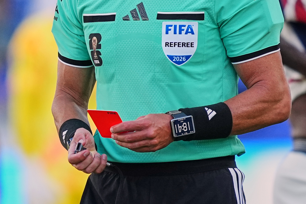 FILE - Referee Raphael Claus, of Brazil, holds the red card after sending United States' Folarin Balogun off the pitch during the World Cup round of 32 soccer match between the United States and Bosnia in Santa Clara, Calif., near San Francisco, Wednesday, July 1, 2026. (AP Photo/Martin Meissner, File)